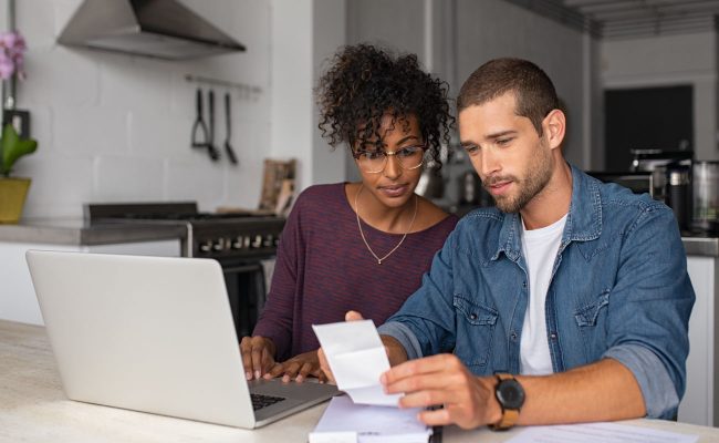 a couple looking over their papers