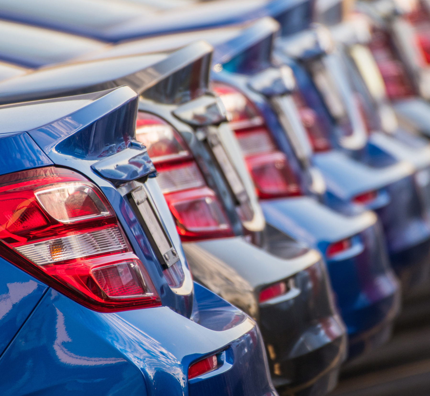 Row of cars at a car dealership