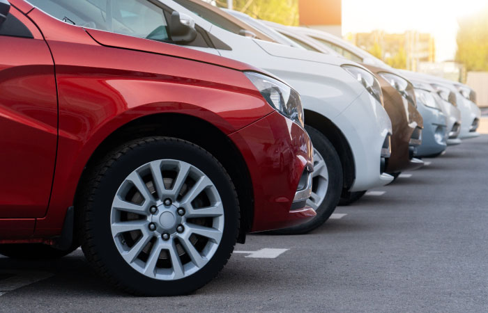 A row of cars at a dealership